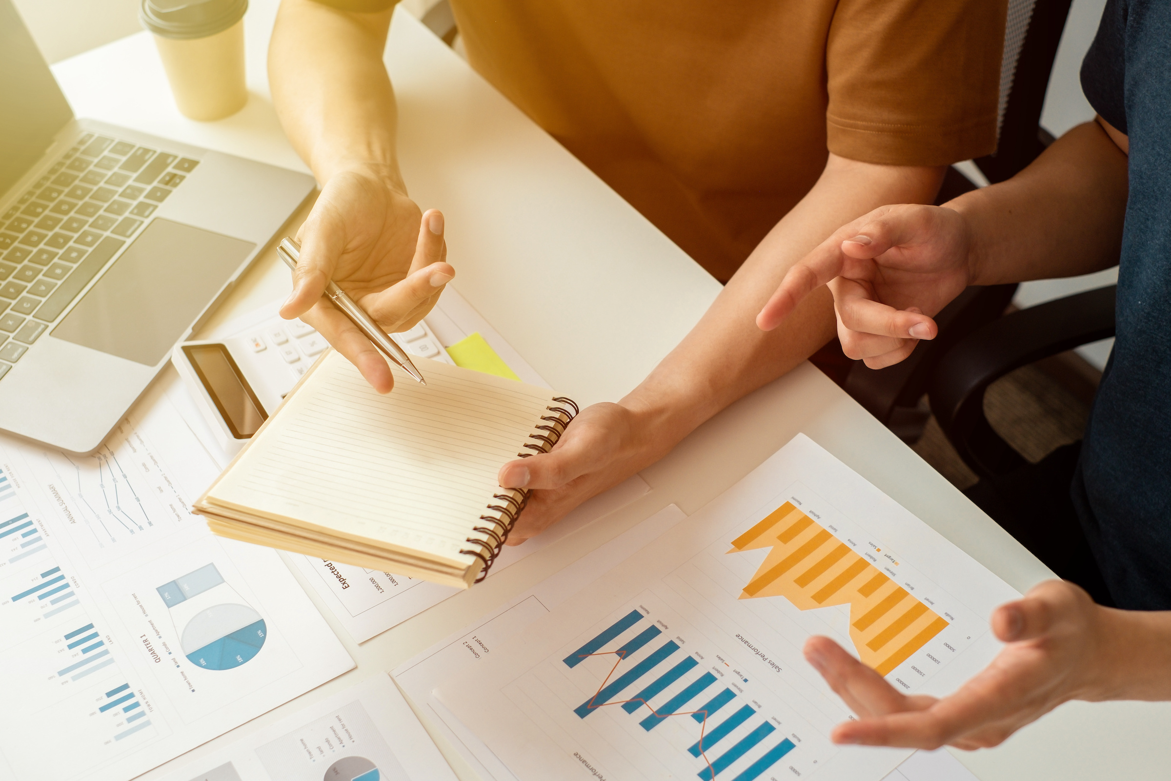 Two People Discussing Financial Documents